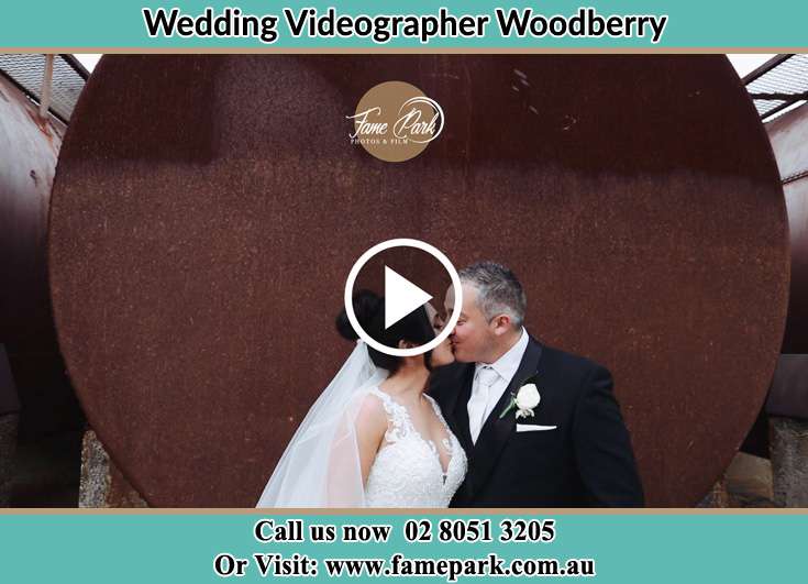 The newlyweds kissing Woodberry NSW 2322